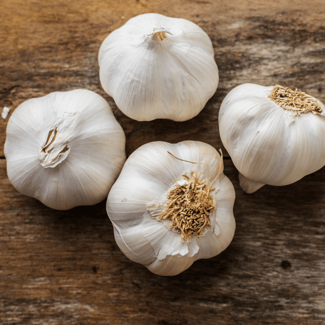 Garlic in a white mesh bag isolated on white background with Clipping Path.  7615558 Stock Photo at Vecteezy